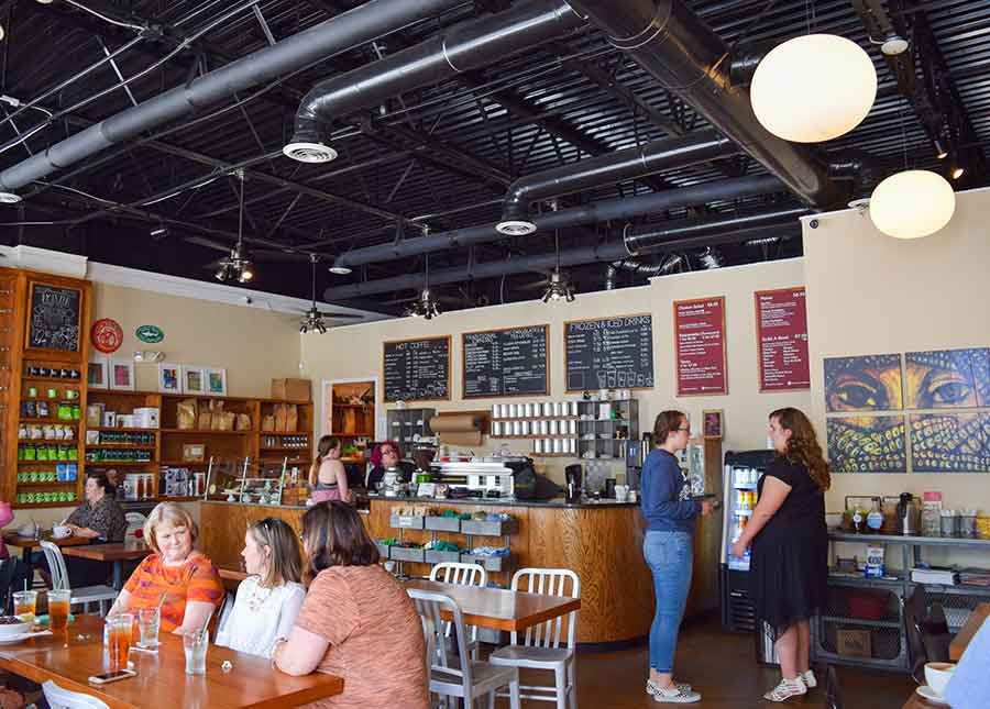 Customers enjoying coffee from Amavida's cafe at St Andrews, FL.